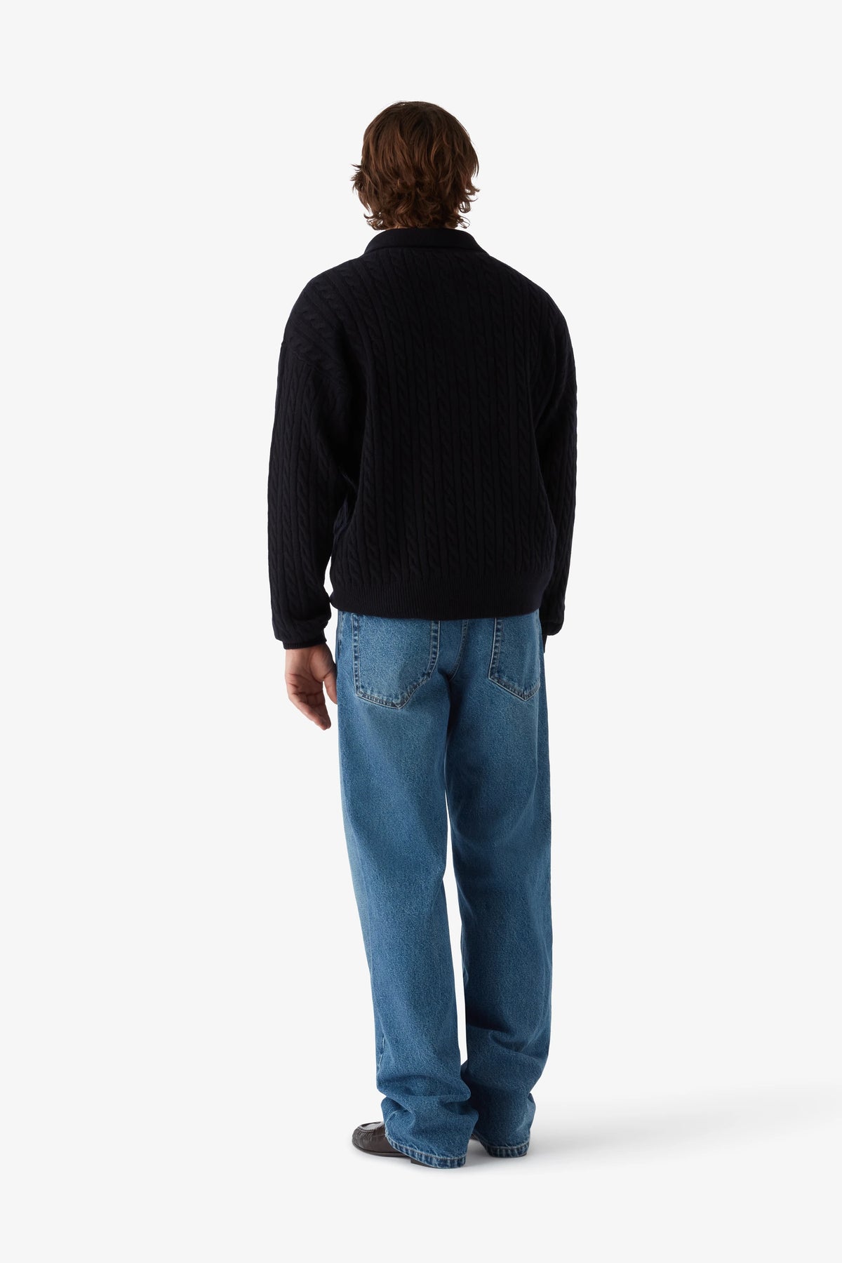 
Renné Knitted Cable Polo in navy — on-model view 49