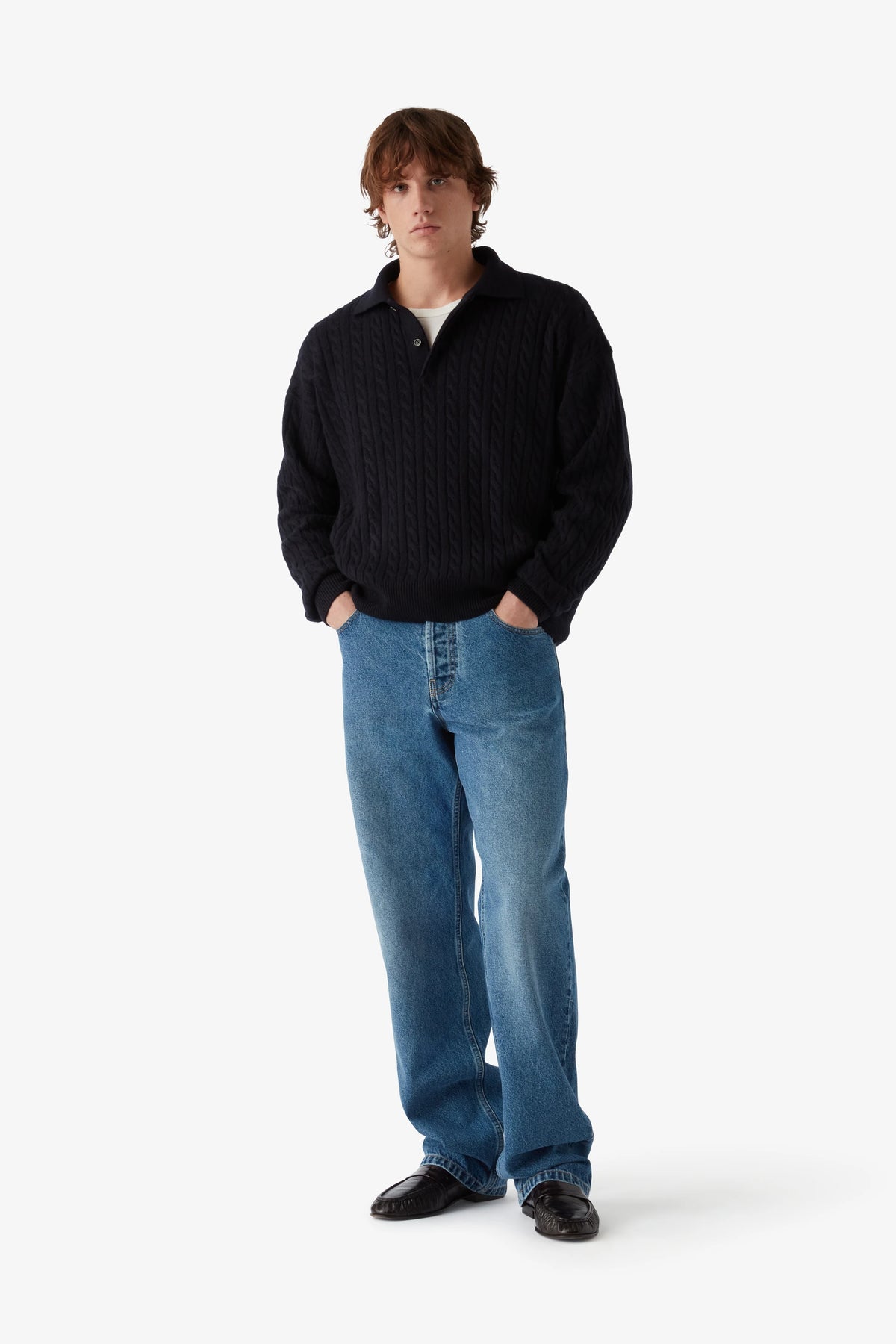 
Renné Knitted Cable Polo in navy — on-model view 50